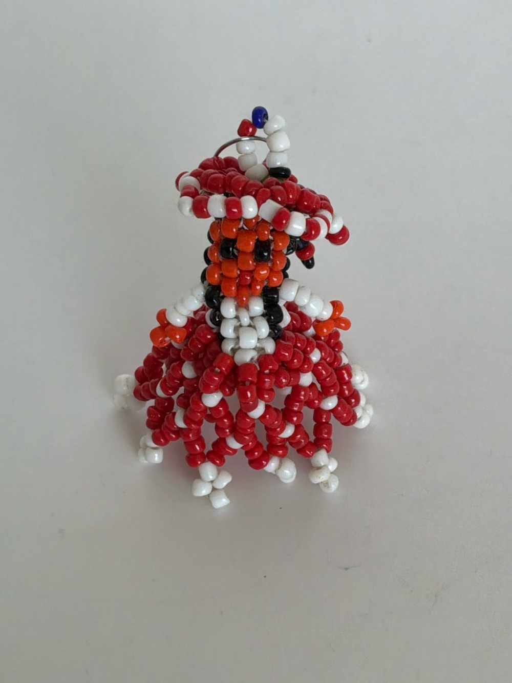 Handmade Beaded Doll Charm in Red, White, Orange & Black